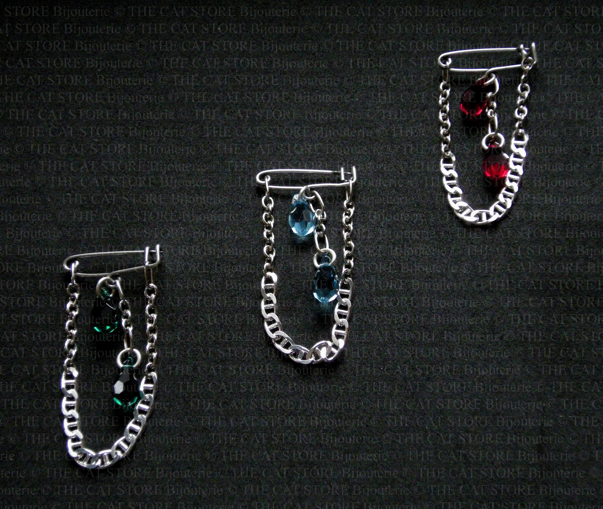 Broche/Bijou de sac Cascade: trois couleurs disponibles émeraude, aigue-marine et rubis